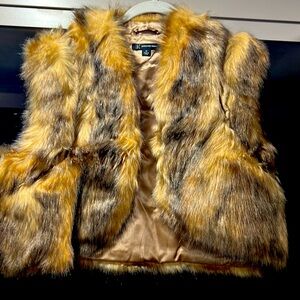 Fake fur vest and it has like around suede to